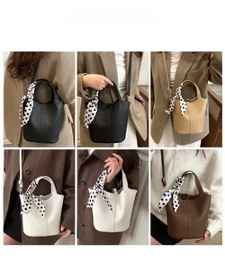 Detailed views of the soft leather bucket bag in black, khaki, white, and dark brown colors