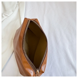 Top view of large capacity brown leather shoulder bag showing interior space and zipper