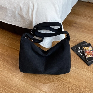 Minimalist large black hobo tote bag with adjustable shoulder strap for casual daily use