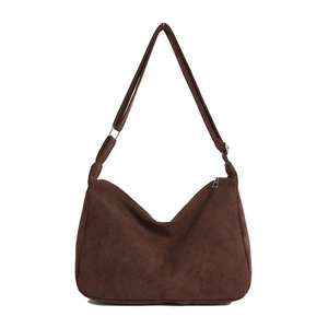 Brown suede hobo bag with adjustable shoulder strap and silver zipper closure