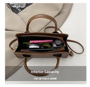 Top view of brown matte tote bag interior showing capacity for phone and wallet