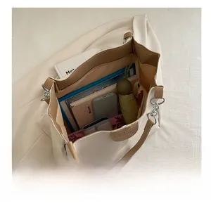 Top view showing spacious interior compartments of the tote bag with daily essentials