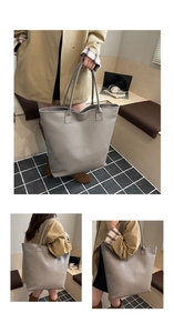 Detail of grey woven leather tote bag with soft texture and long shoulder straps