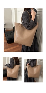 Close-up of khaki tote bag showing woven texture and durable double shoulder straps