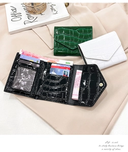 Detailed interior of crocodile pattern wallet with multiple card slots and photo window