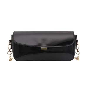 Minimalist black patent leather saddle bag with gold buckle and chain strap for women