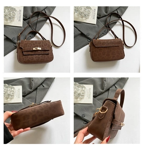 Detail view of brown leopard print crossbody bag with suede texture and gold metal hardware