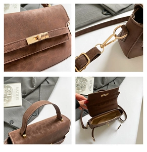 Detail view of brown vintage handbag featuring gold twist lock and adjustable shoulder strap