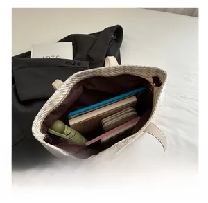 Interior view of large capacity beige woven tote bag showing spacious storage for essentials