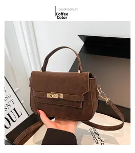 Detail of coffee brown crossbody bag with leopard texture and golden lock clasp