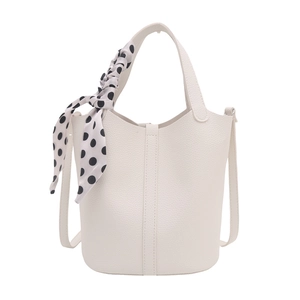 White lychee pattern leather bucket bag with a stylish polka dot scarf and shoulder strap