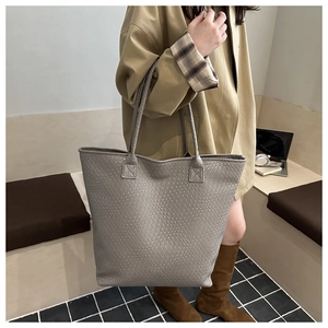 Detailed view of the intricate grey woven texture on this large capacity tote bag