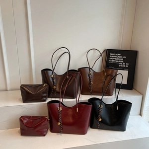 Set of four minimalist faux leather tote bags in dark brown and black with matching pouches