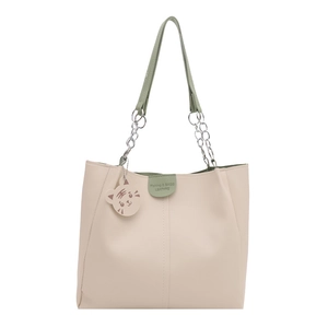 Minimalist beige tote bag with grey-green accents, silver chain strap and tiger charm