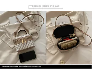 Detail view of vintage cylinder bag showing interior capacity and monogram pattern