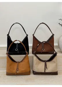 Four colors of vintage faux suede hobo bags with leather patchwork and metal rings