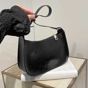 Retro black oil wax leather underarm bag with gold zipper and minimalist crescent shape