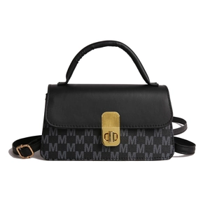 Chic black crossbody bag for women with gold clasp and monogram M pattern