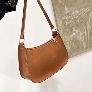 Retro brown faux leather hobo shoulder bag with crescent shape and gold zipper detail