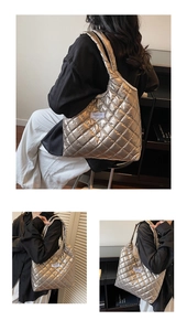 Close-up of metallic quilted puffer tote bag with diamond stitching and fashion label