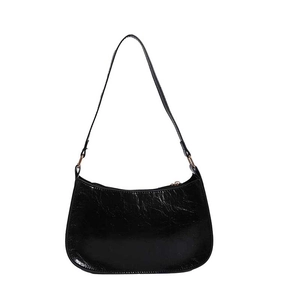 Minimalist black glossy patent leather crescent shoulder bag with gold zipper detail