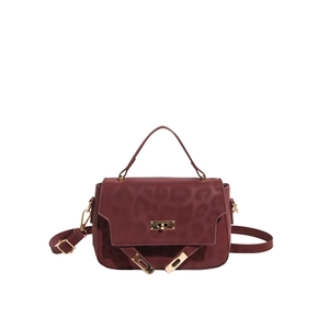 Deep red leopard embossed leather crossbody bag with golden clasp and shoulder strap