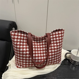 Chic red and white houndstooth tote bag with brown leather straps for autumn fashion