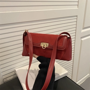 Retro red baguette shoulder bag in matte leather and suede with golden H buckle