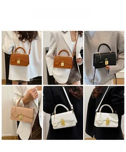 Vier minimalistische Umhängetaschen aus Leder in Braun, Schwarz, Beige und Weiß im Detail