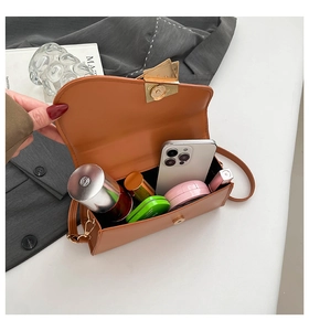 Internal view of brown PU leather crossbody bag showing capacity for daily essentials
