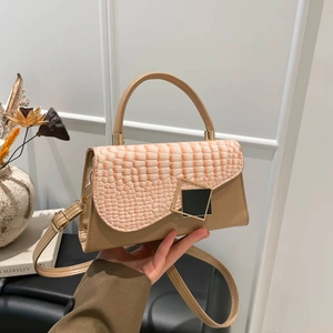 Elegant two-tone faux crocodile leather handbag with metal buckle and shoulder strap