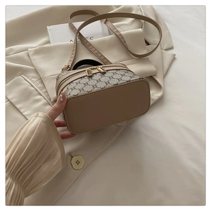 Detail of vintage monogram box bag with beige canvas and light leather trim