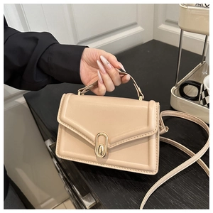 Beige PU leather small square handbag with a gold oval rotating lock and shoulder strap
