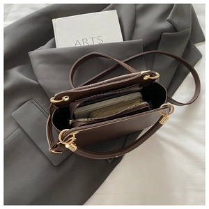 Internal layout of dark brown leather handbag showing spacious storage for daily items