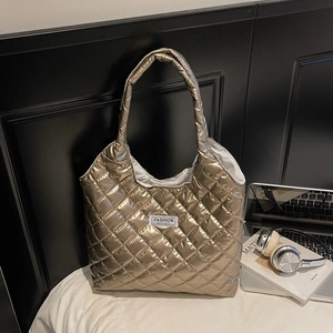 Champagne gold quilted puffer tote bag with diamond lattice pattern for daily commute