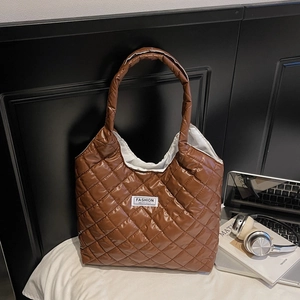 Brown quilted puffer tote bag with diamond stitching and Fashion Instinct label for commute