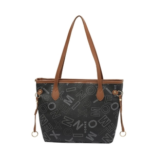 Vintage printed tote bag with HORHE monogram and brown leather handles for daily commute