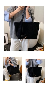 Detail view of large black tote bag with slim straps and a matching eyeglass case pouch