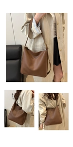 Close-up of caramel brown leather bucket bag with adjustable strap and metal buckle detail