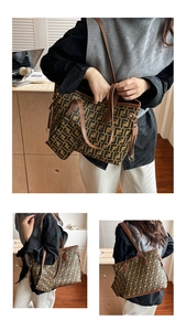 Detail view of large printed tote bag set with matching pouch and brown leather handles