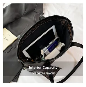 Top view showing the large internal capacity of the brown printed tote bag with daily items
