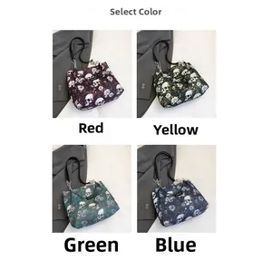 Detail of four floral skull print tote bags in red, yellow, green and blue colors