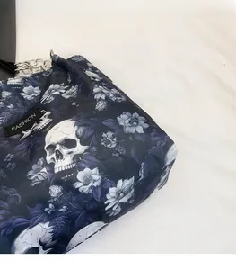 Detailed macro view of the skull and purple floral print on waterproof nylon fabric