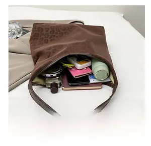 Interior view showing the large capacity of a leopard print faux suede tote bag