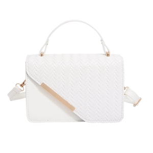White woven crossbody bag with diagonal flap and gold metallic bar accent on white background