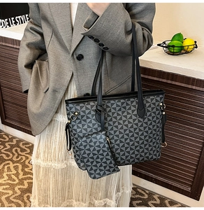 Macro view of vintage tote bag set with geometric grey triangle pattern and mini pouch