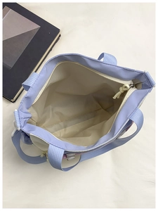 Internal view of minimalist tote bag showing spacious main compartment and zipper closure