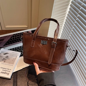 Vintage dark brown rhombic small tote bag with silver metal turn-lock and shoulder strap