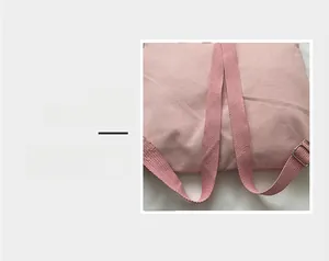 Detail magnification of durable pink canvas straps with metal buckles for backpack
