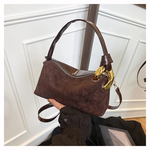 Brown suede shoulder bag for women with decorative chunky gold chain and slim strap